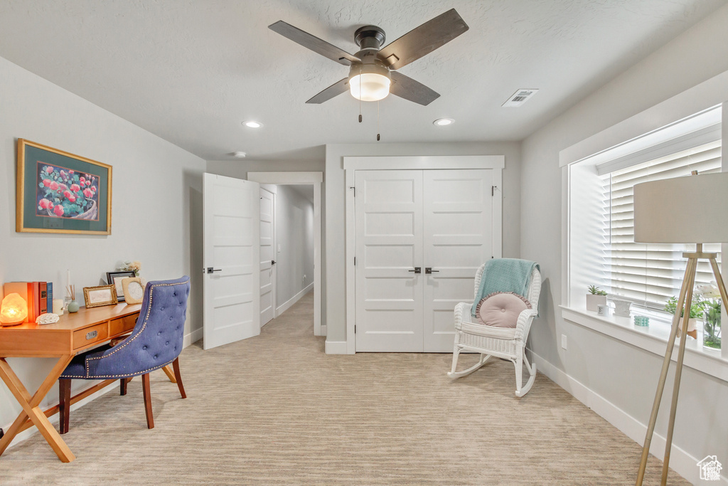 Office space featuring a ceiling fan, recessed lighting, baseboards, and light colored carpet