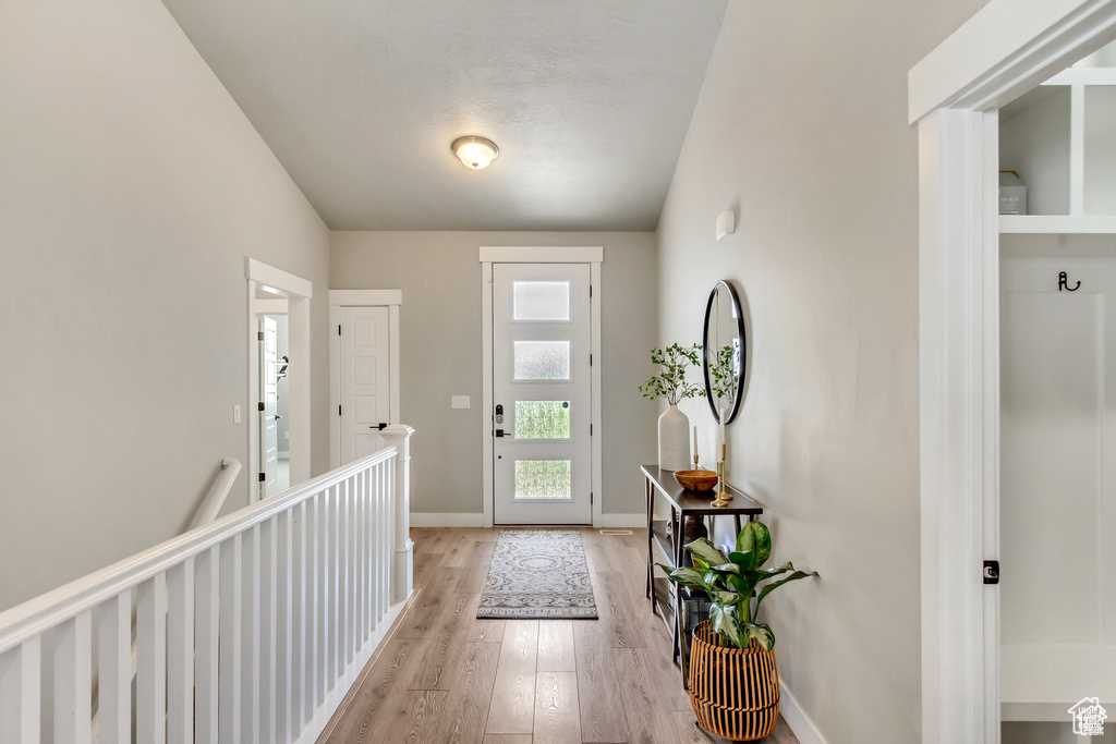 Entryway featuring light wood-type flooring and baseboards