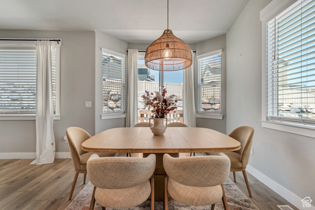Dining area featuring wood finished floors and baseboards