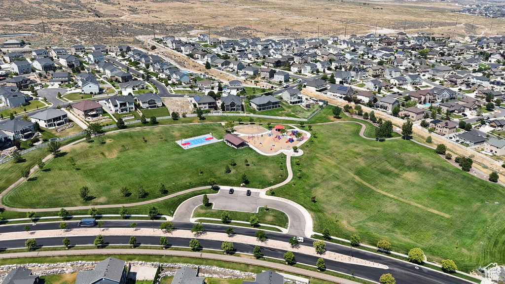 Aerial view of property's location featuring nearby suburban area