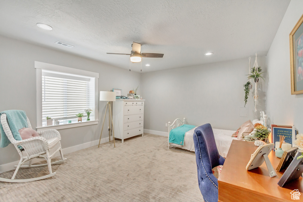Carpeted office space with ceiling fan, recessed lighting, and baseboards