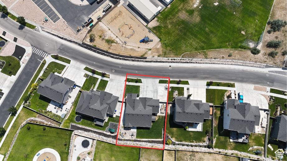Aerial perspective of suburban area featuring property parcel outlined