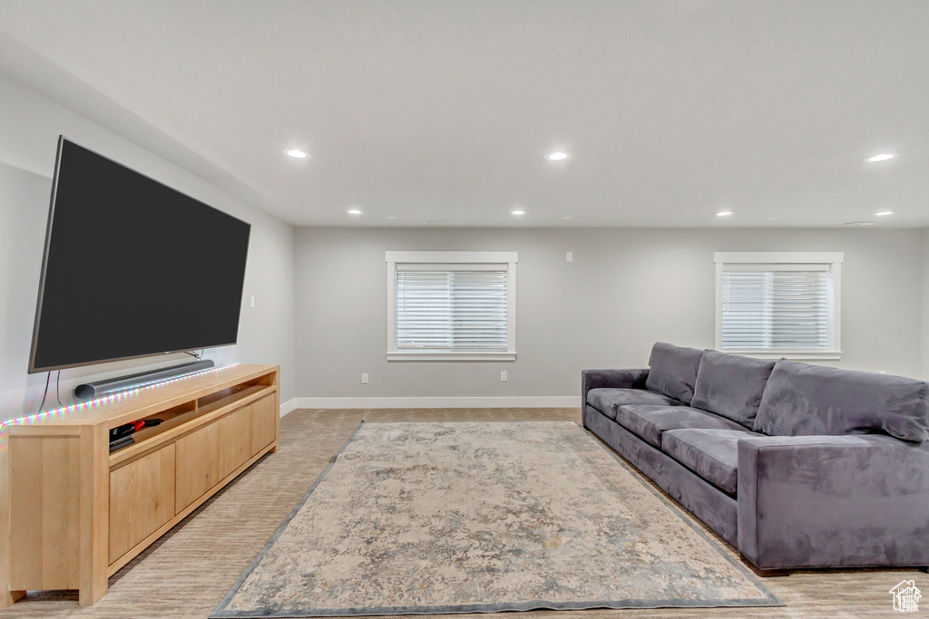 Living room with recessed lighting and baseboards