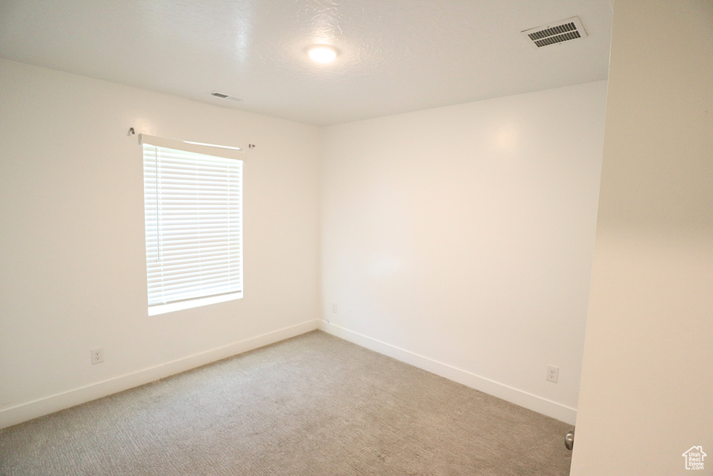 Unfurnished room with baseboards and carpet floors