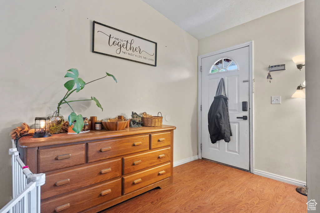 Entryway featuring light wood finished floors and baseboards