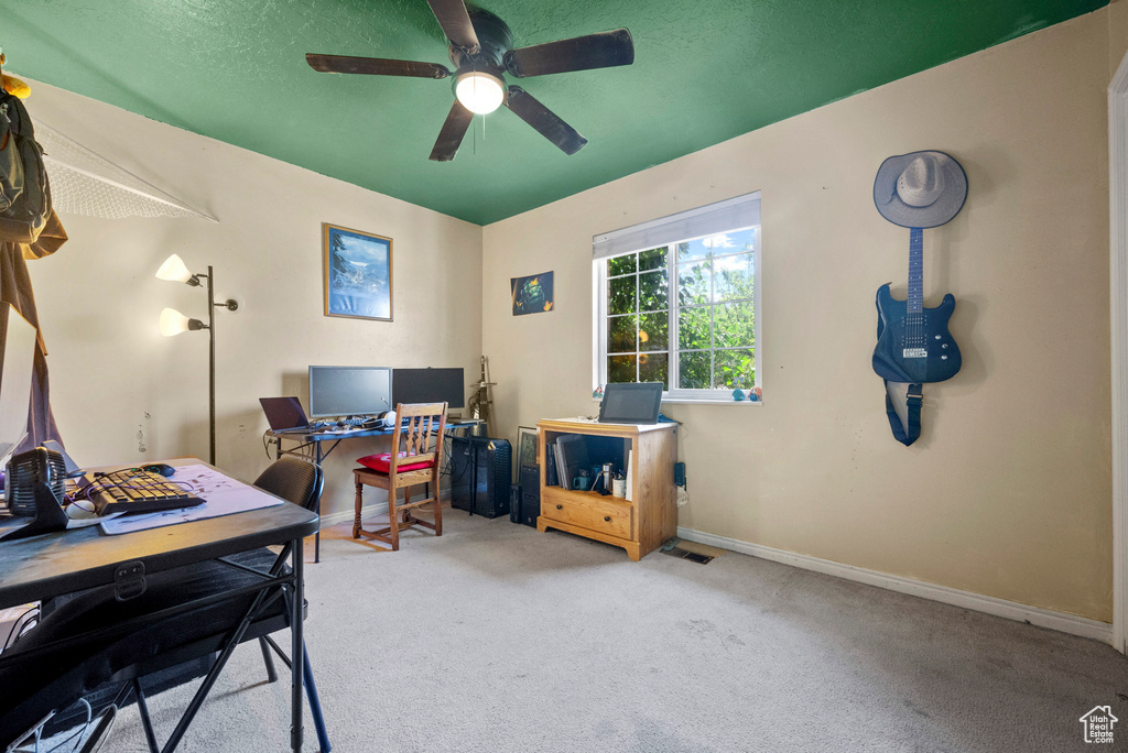 Office featuring carpet, ceiling fan, and baseboards