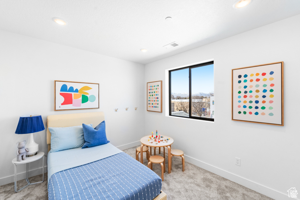 Bedroom with carpet flooring, baseboards, and recessed lighting
