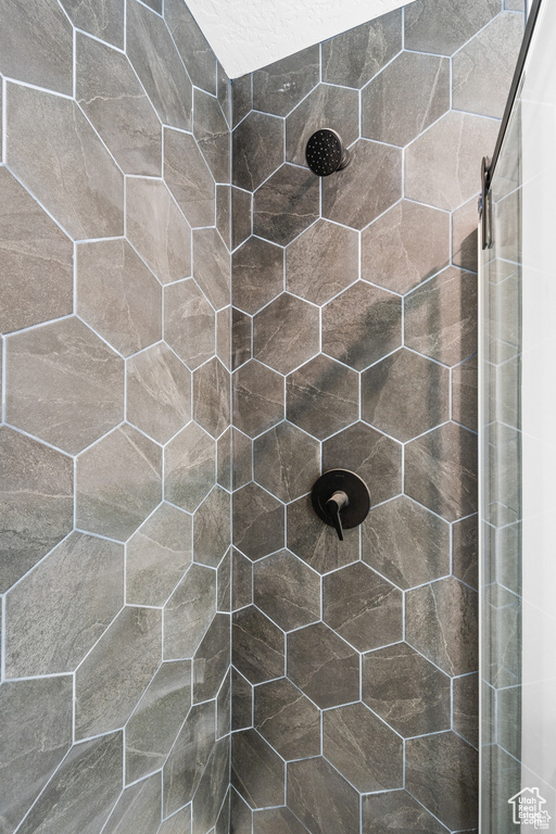 Full bathroom with tiled shower