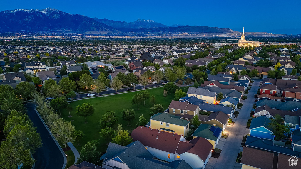 Aerial perspective of suburban area featuring a mountain backdrop