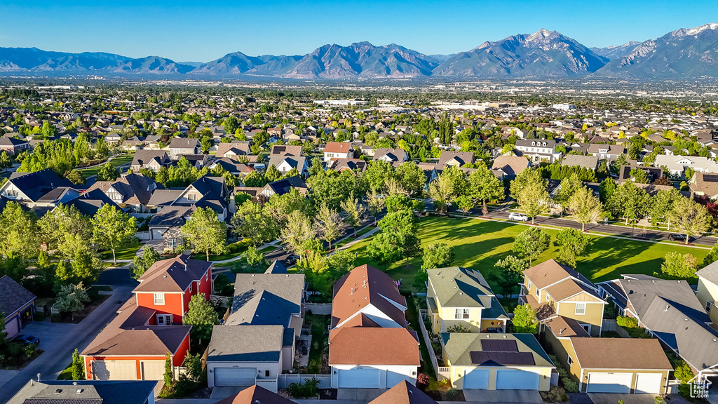 Aerial view of residential area with a mountainous background