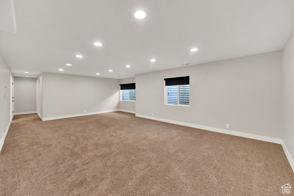 Spare room with carpet floors, recessed lighting, and baseboards