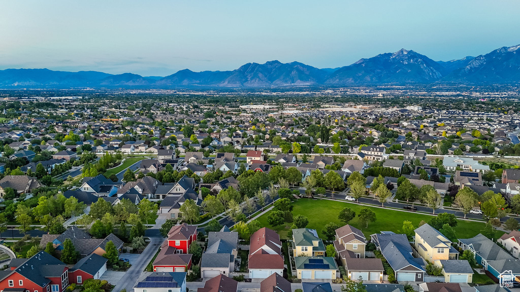 Aerial view of residential area featuring mountains