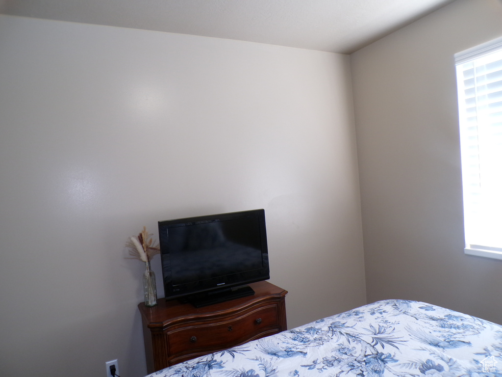 Bedroom featuring multiple windows