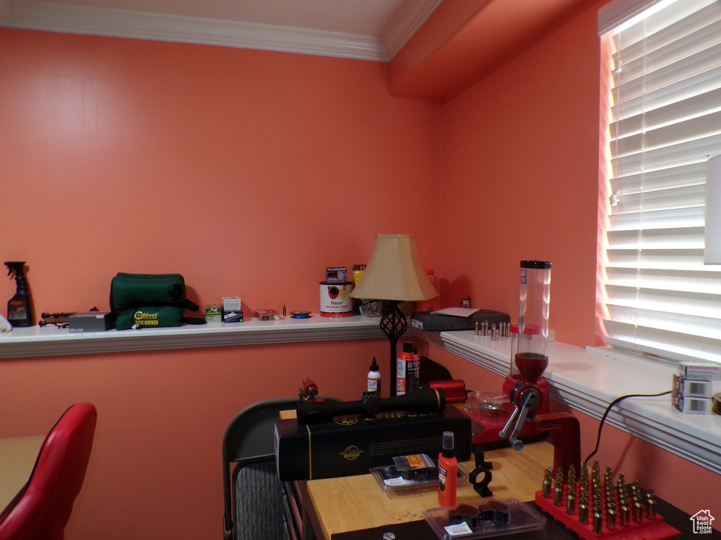 Office space with ornamental molding and wood finished floors