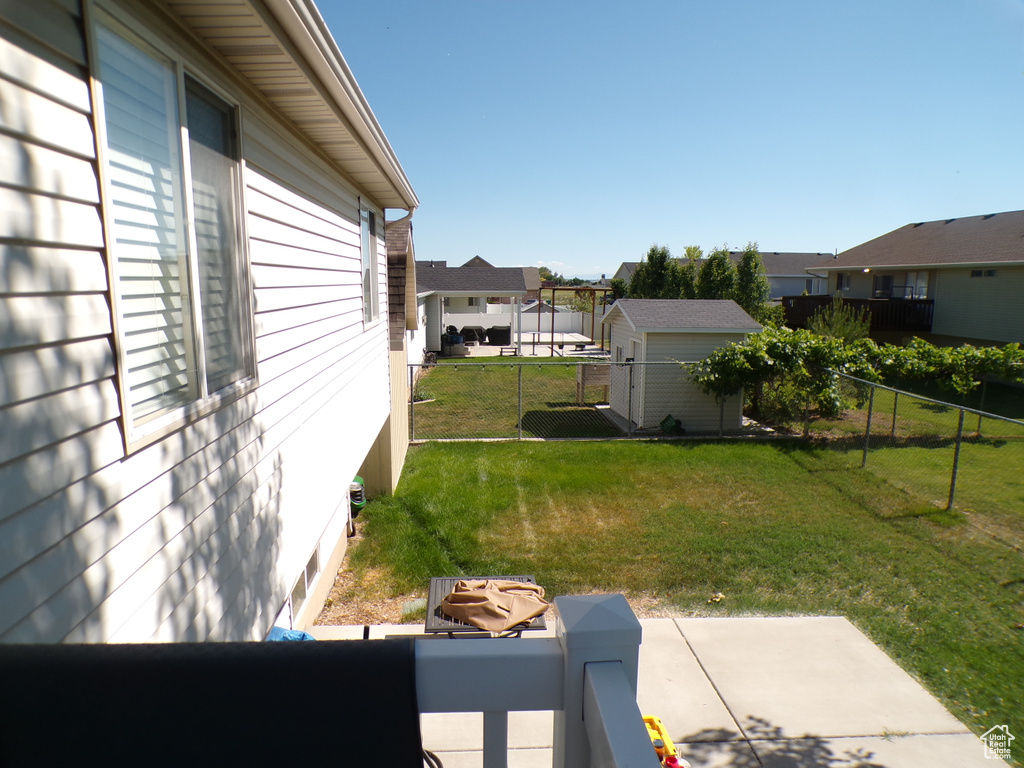 View of yard with a residential view and a patio