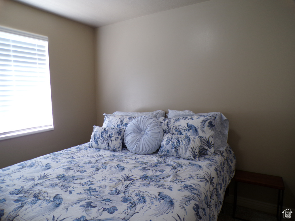 Bedroom with multiple windows