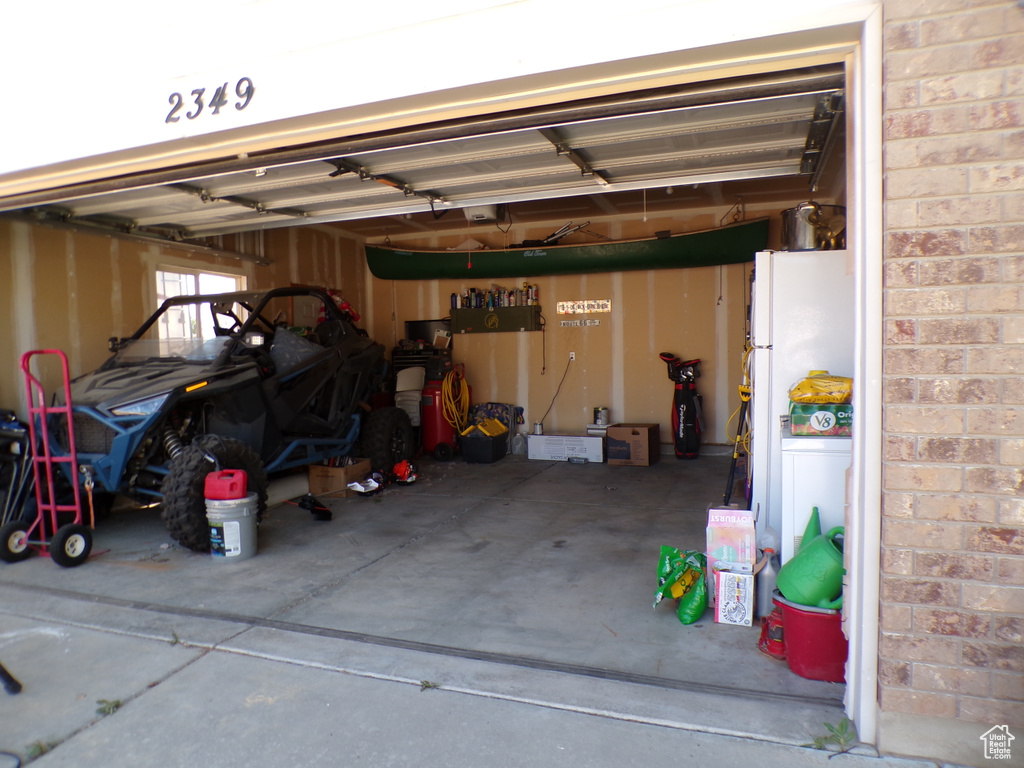 Garage with freestanding refrigerator