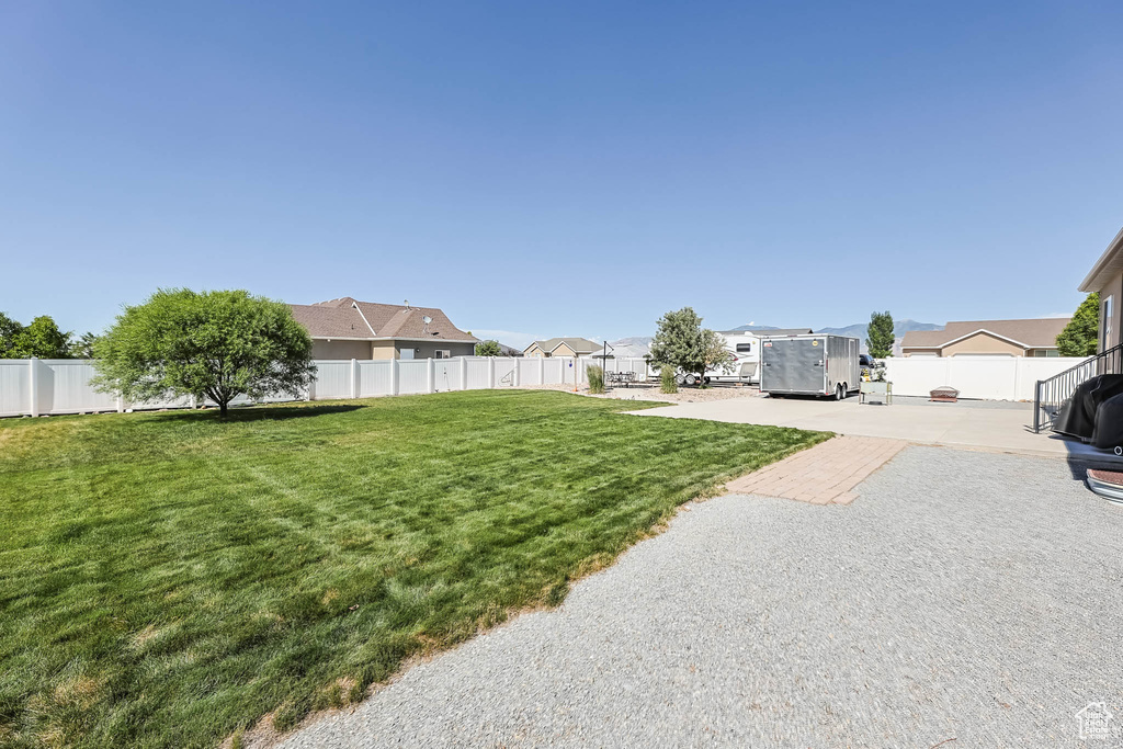 View of yard with a patio area and a residential view