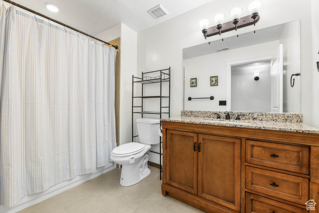 Bathroom with vanity and toilet