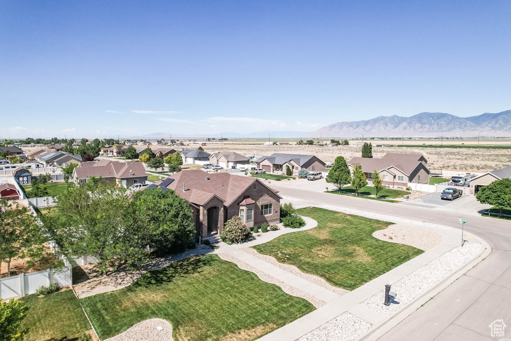 Aerial view of residential area featuring mountains