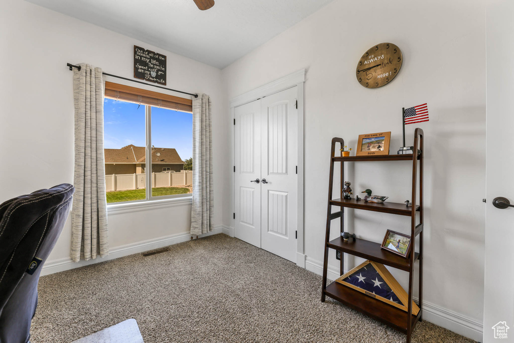 Office with baseboards and carpet
