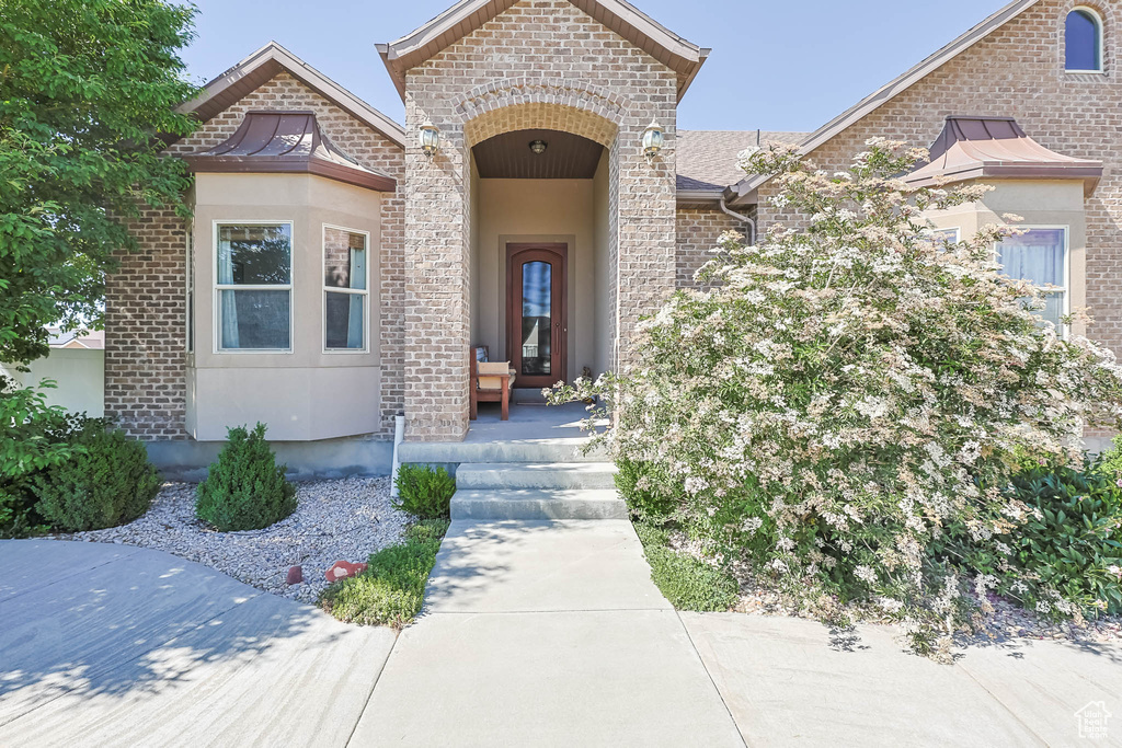 Entrance to property with brick siding