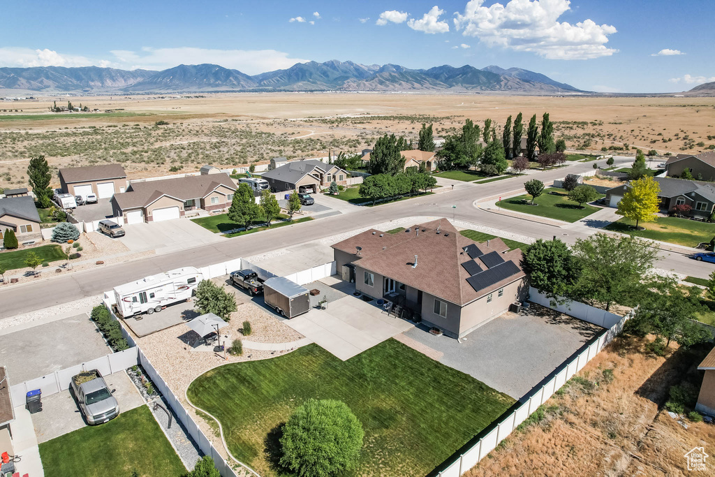 Aerial perspective of suburban area with a mountain backdrop