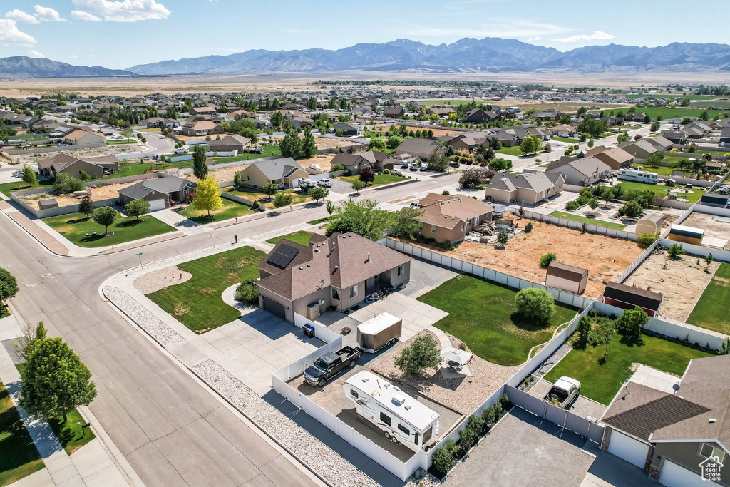 Aerial perspective of suburban area featuring a mountain backdrop