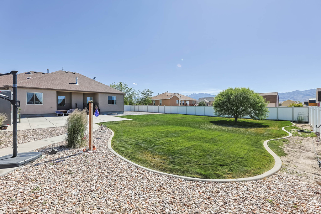 View of yard with a patio area
