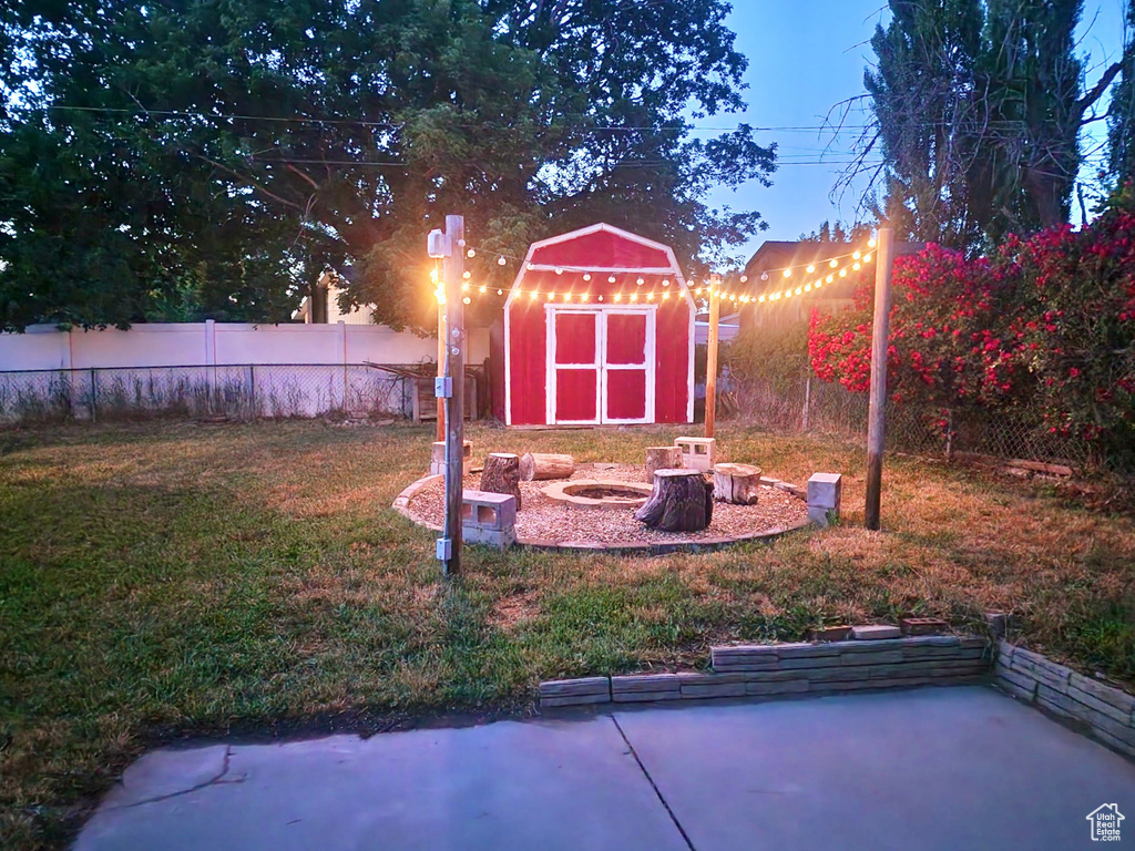 View of yard featuring an outdoor fire pit and a patio