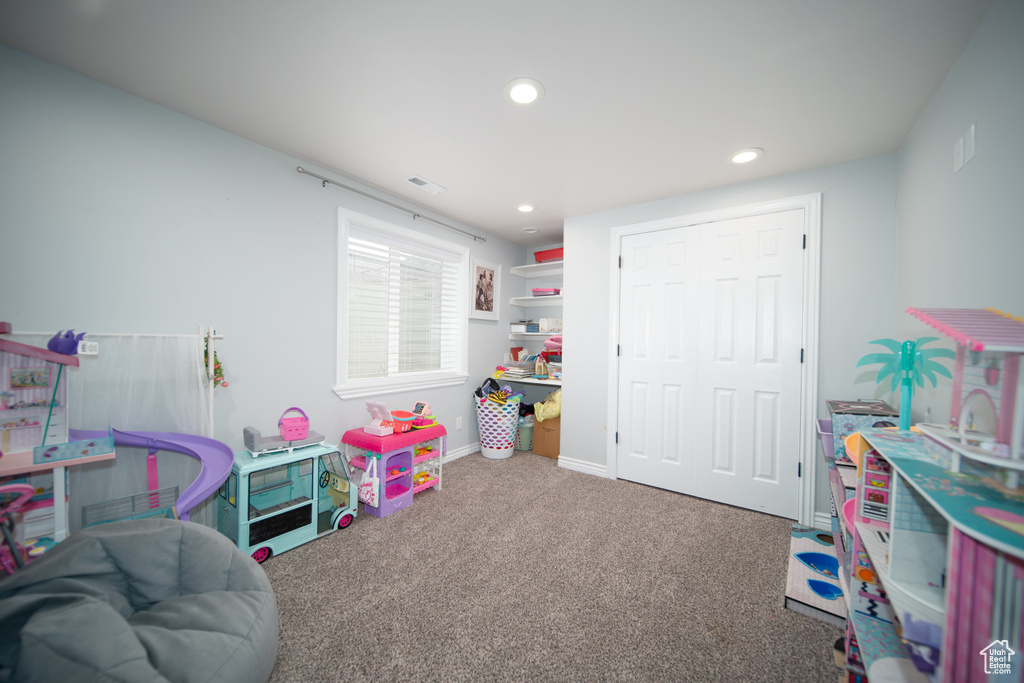 Game room featuring carpet flooring, recessed lighting, and baseboards