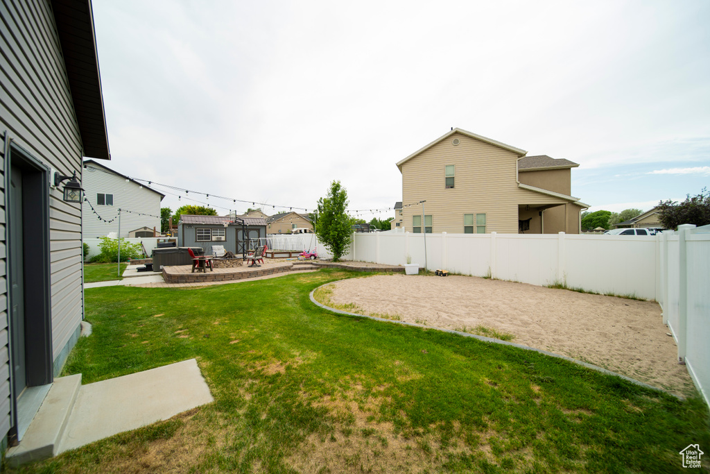 View of yard with a patio