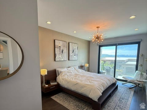 Bedroom featuring dark wood finished floors, baseboards, and recessed lighting