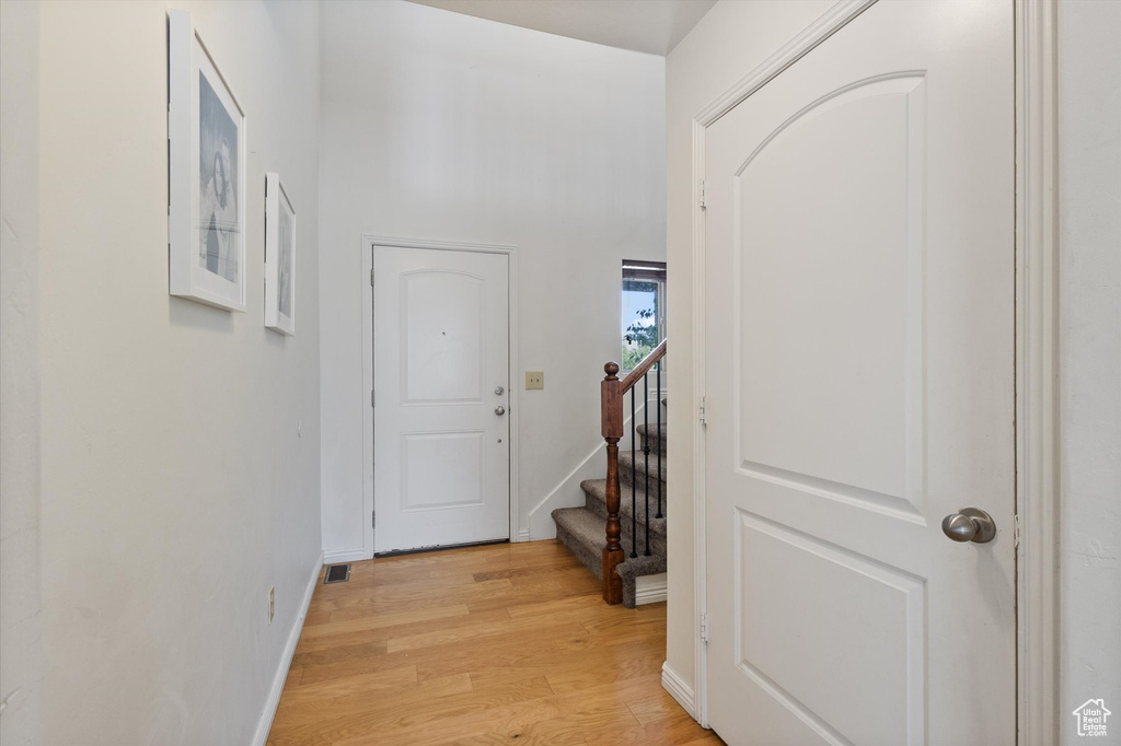 Foyer entrance featuring light wood-type flooring and stairs