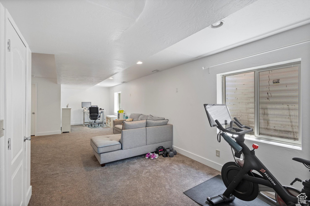 Workout room with carpet and recessed lighting