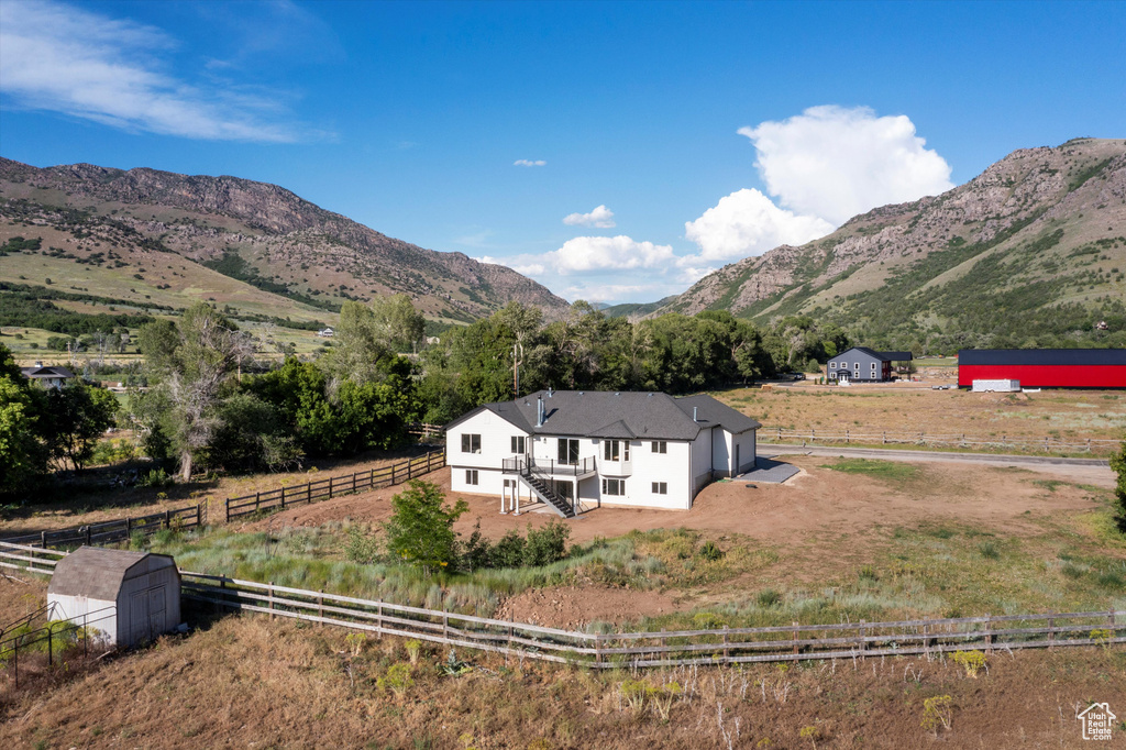 View of mountain background featuring rural landscape
