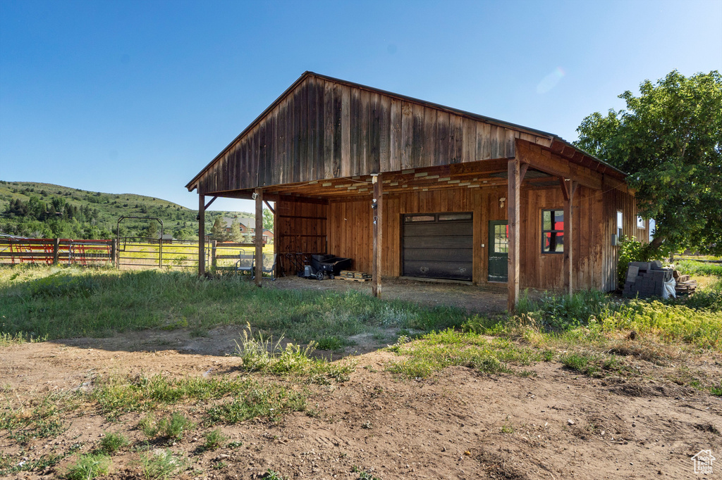 View of outbuilding with a mountain view