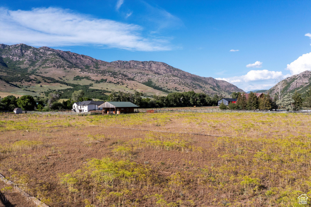 View of mountain backdrop with rural landscape