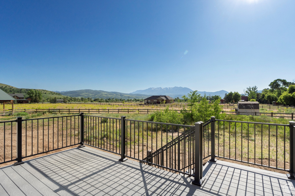 Deck featuring a view of countryside and a mountain view