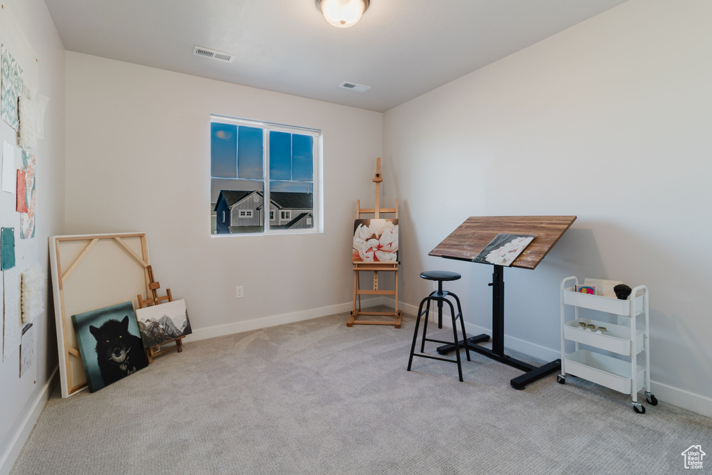 Misc room featuring carpet flooring and baseboards