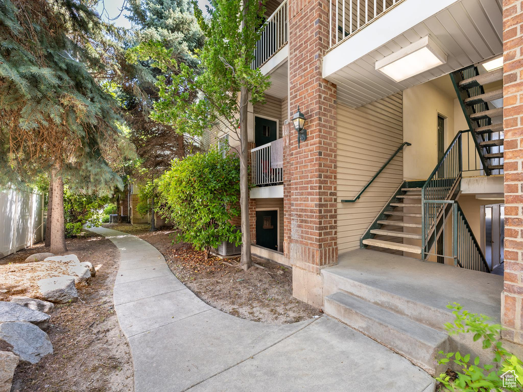 View of property's community featuring stairs
