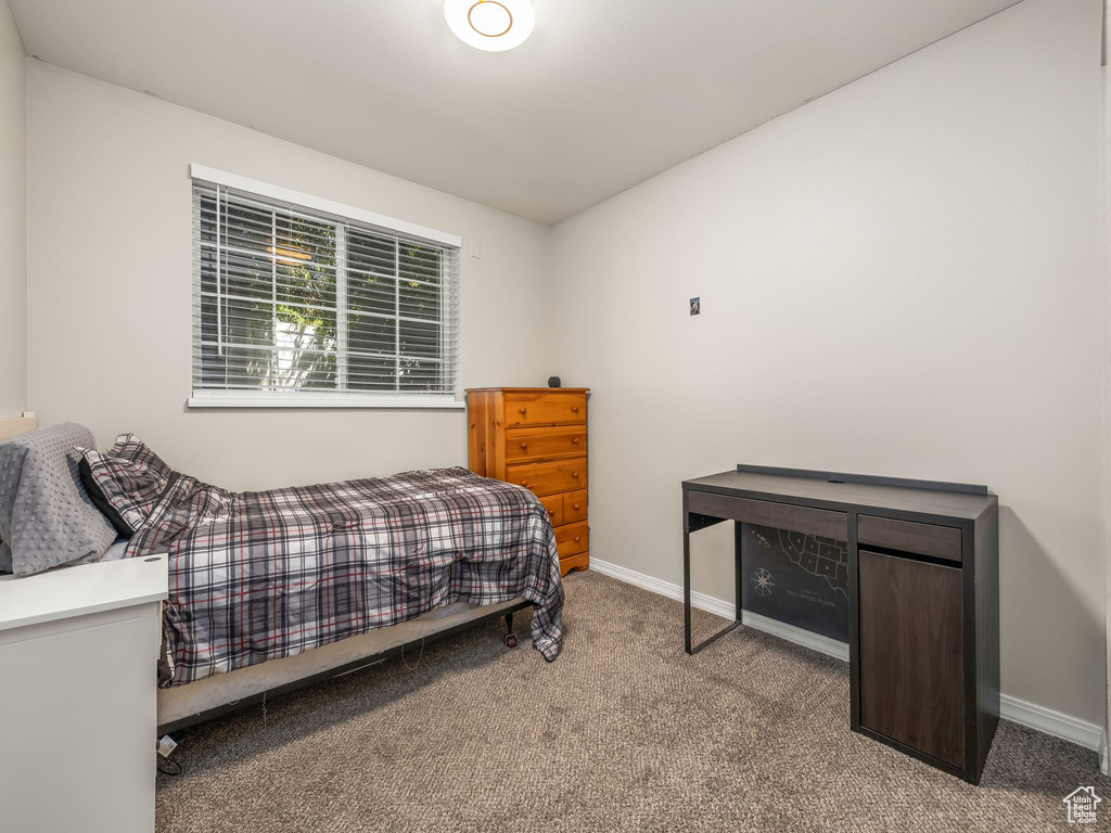 Carpeted bedroom with baseboards