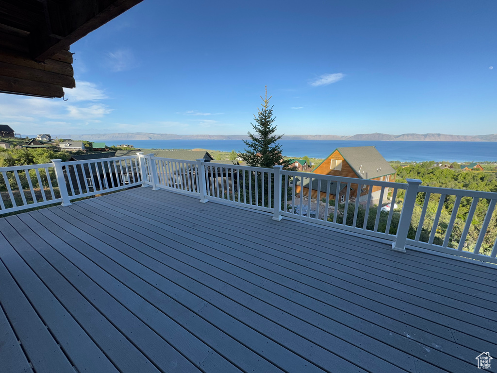 Wooden terrace with a water and mountain view