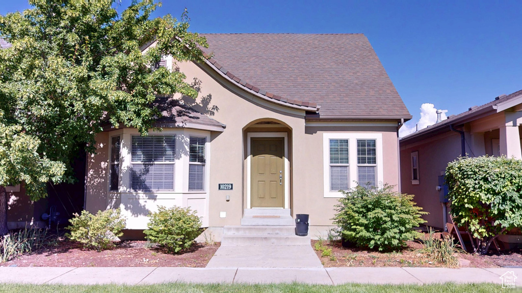 View of front of home with stucco siding