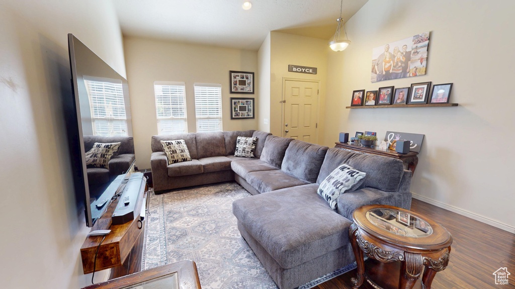 Living area with wood finished floors and baseboards