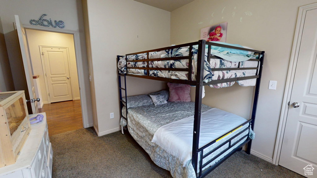 Carpeted bedroom with baseboards