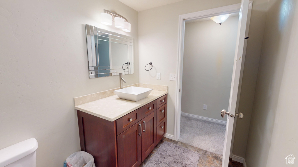 Bathroom with toilet and vanity