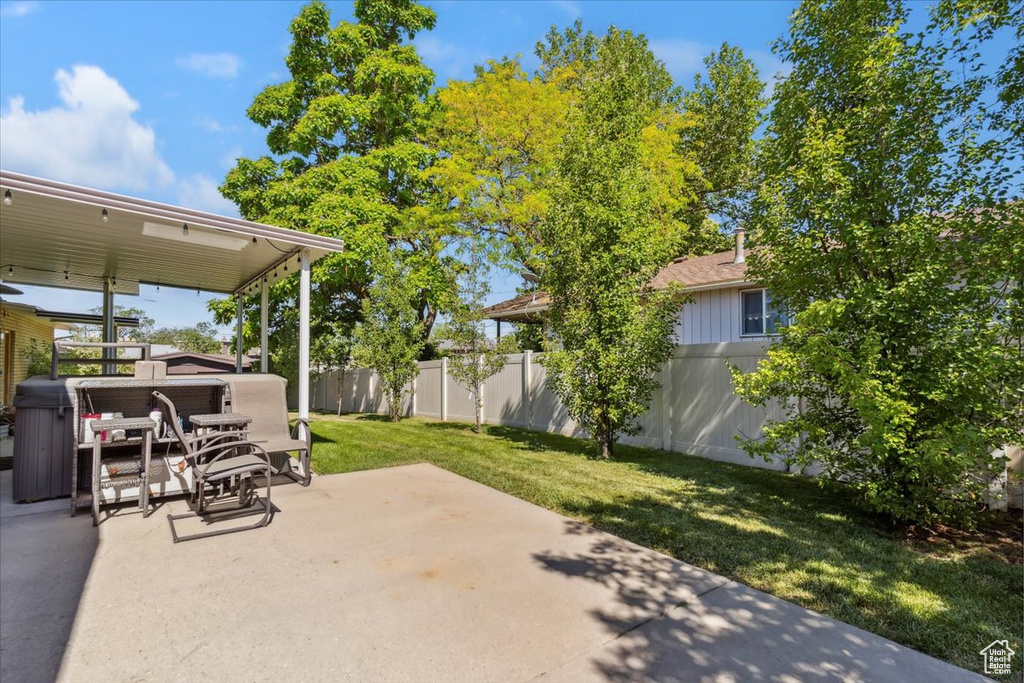 View of patio featuring a hot tub