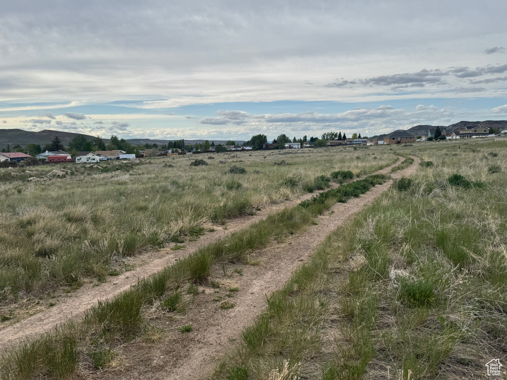 View of undeveloped land with mountains and rural landscape