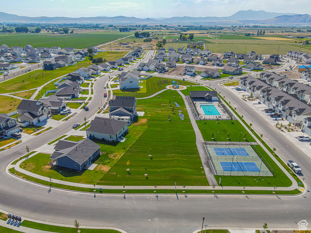 Aerial perspective of suburban area with a mountainous background